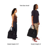 Two models holding black Just Fred Companion dog tote bags to demonstrate size, with text indicating tote size and model heights.