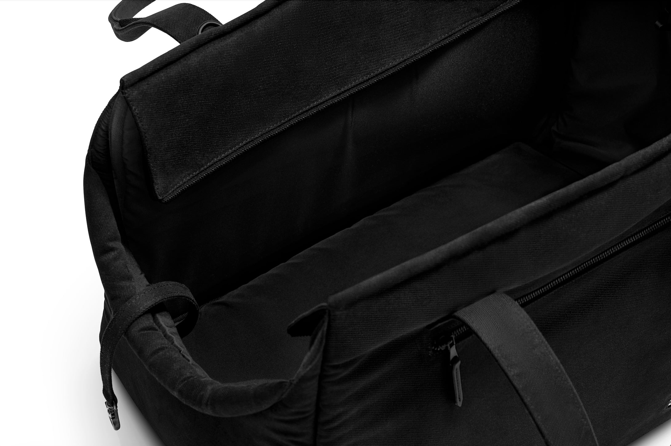 Black Just Fred x Fem World by Ally Lindsay Weekend Tote dog pet carrier viewed from above to show zip opening and soft chin rest, on a white background