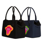 Two small Just Fred Weekend Tote dog carrier bags in navy and Black featuring lip design by Fem world by Ally Lindsay, on a white background