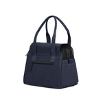 A navy-colored Just Fred Destination Dog Tote with a breathable mesh enclosure and an exterior peek-a-boo window, featuring dual handles, back zipped pocket and a vegan leather base, on a white background