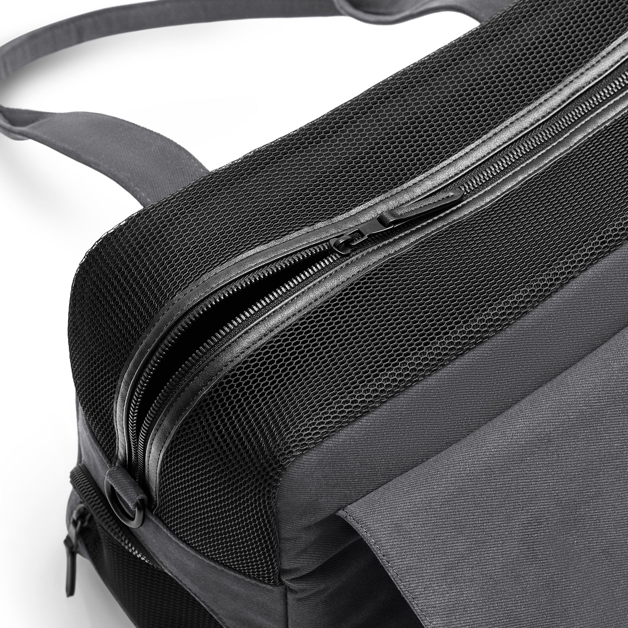 Gray Just Fred Destination Tote pet dog carrier zoomed into the top zipped panel featuring breathable mesh top and side window, on a white background